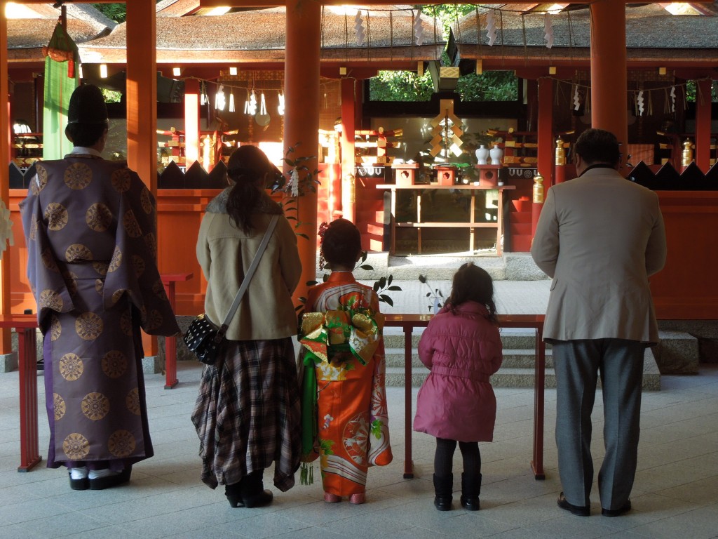 A family performing the 7-5-3 ritual.  A religious event, or a Japanese custom?