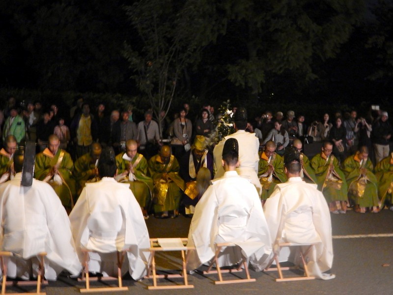 Shinto priest purifying Buddhist priests at the Awata Jinja festival