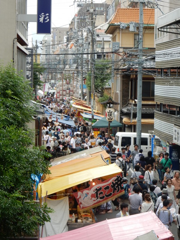 Some of the floats are in narrow packed streets, difficult to negotiate even for the many pedestrians