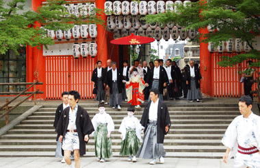 On July 1 the chigo (sacred page) of the main float Naginata-hoko visits Yasaka Jinja to pray for a safe festival. (courtesy Kyoto Visitors Guide)