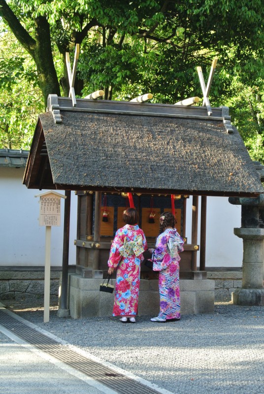 Kimono-clad women at a hokora