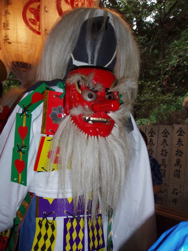 Japan has its own tradition of eerie costumes.  Perhaps cosplay is simply a modern take on the tradition.