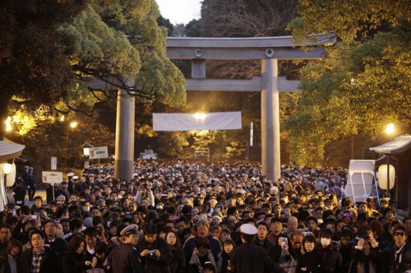 Crowds wait their turn to offer prayers at the Meiji Shrine in Tokyo, on the second day of the New Year Saturday, Jan. 2, 2010. | AP