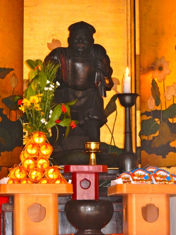 Each subtemple has a statue of one of the Seven Lucky Deities which is the object of worship. This one is Daikokuten.
