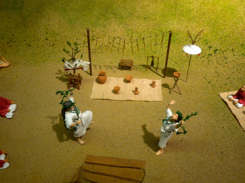 Model of a Yayoi-era ritual, with mirror hanging in the tree