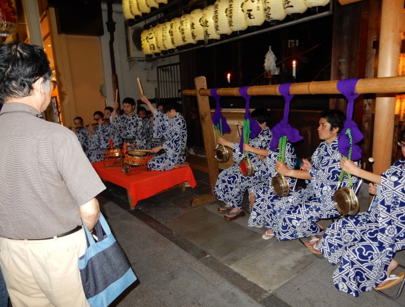 Musicians play at the otabisho of the mikoshi in Shijo Street, downtown Kyoto